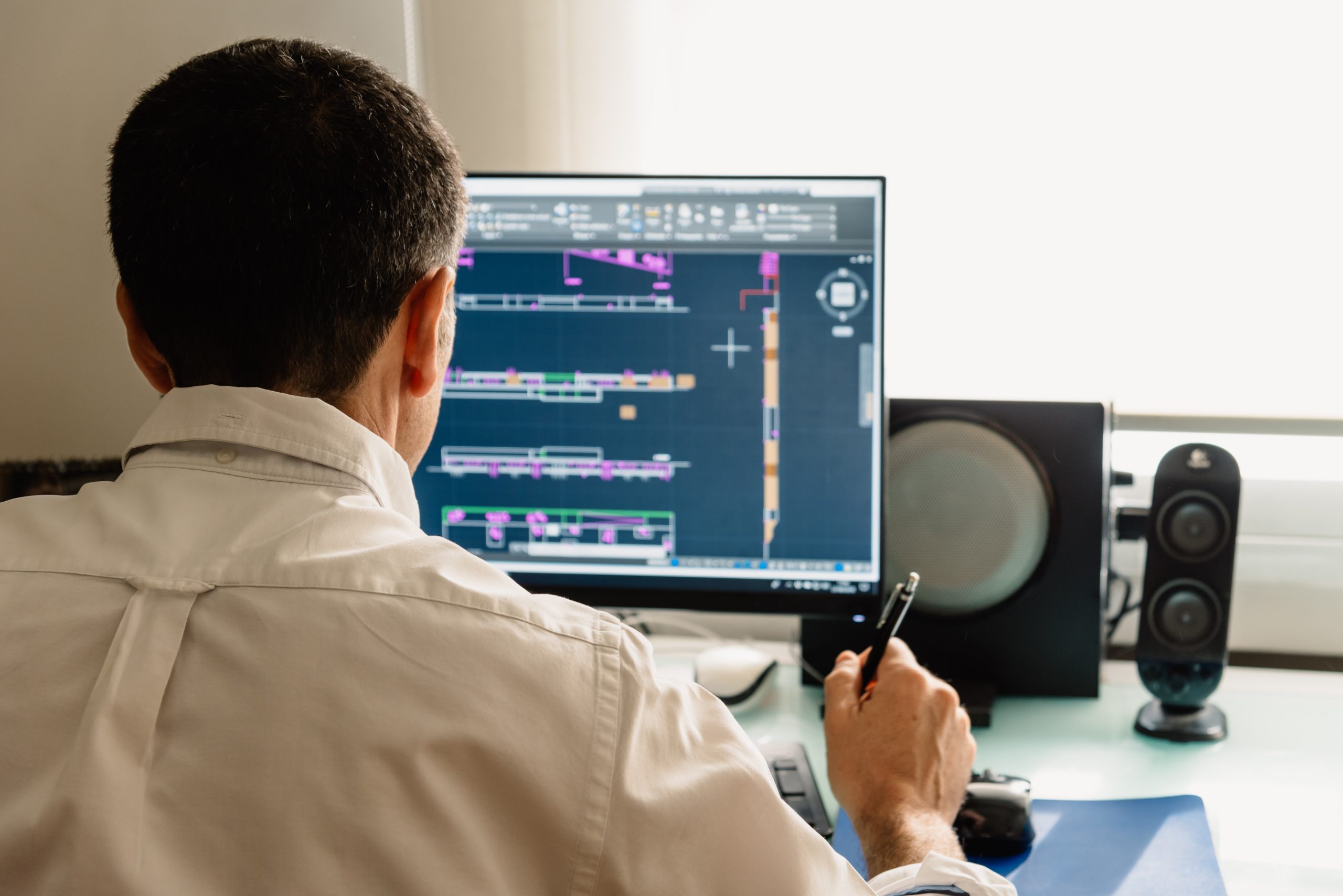 Architect drawing with cad software designing building